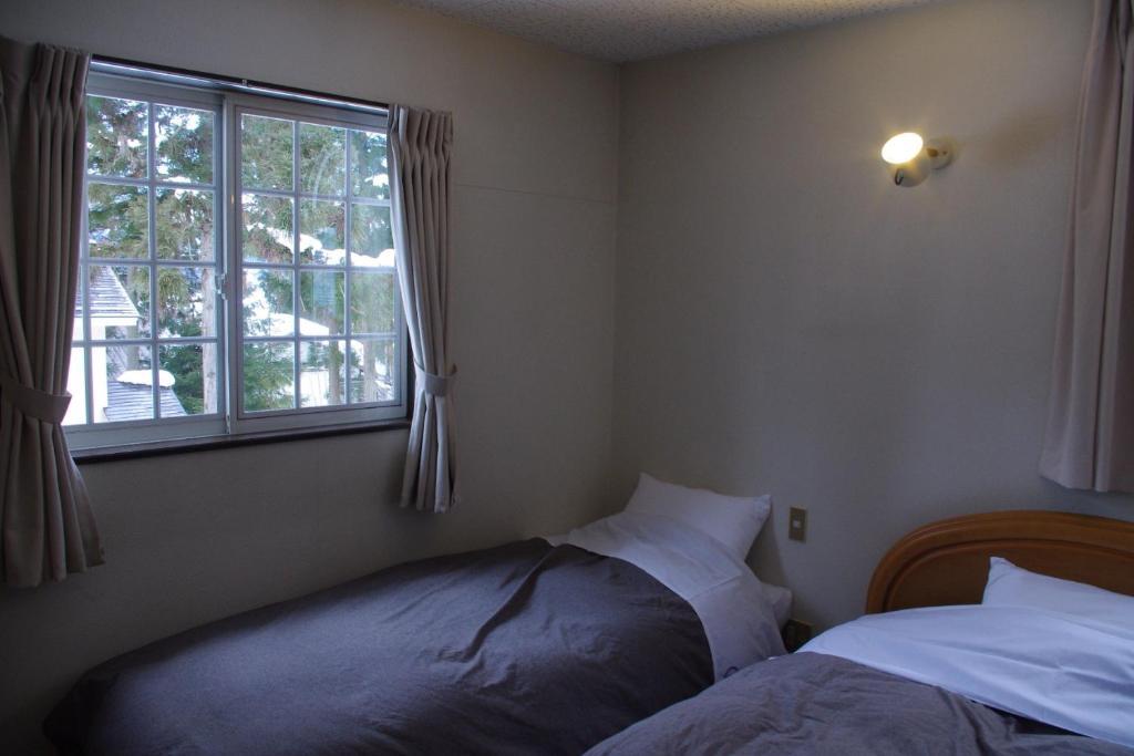 Bed and Breakfast Sunny Side Hut Хакуба-Мура Номер фото
